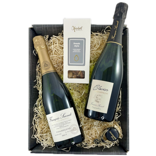 Gaveæske med 2 flasker champagne, mandler og en champagnestopper med "Champagne Stories" logo. Champagne Francois Secondé, Brut Grand Cru & Clavier, 2 Grand Cru champagner